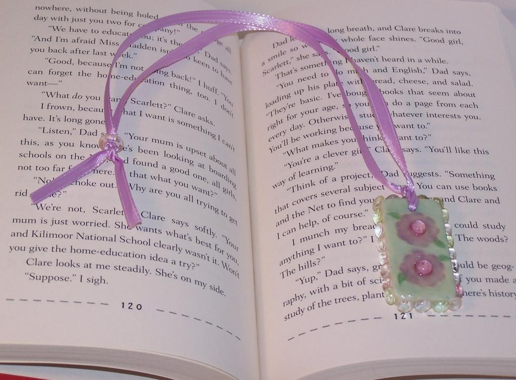 I made this bookmark for my daughters birthday. The base is a domino and the stamped images are...