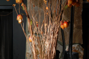 Faux flowers and pomegranates