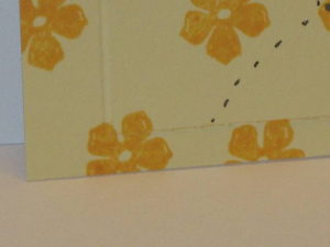 Closeup of perforation and scored corner