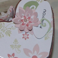 Top of Heart Tin; Sweet Blush Patterned paper; cut out flower with pearl center.