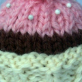 knitted cupcake pincushion that is inside the retro oven