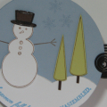 This card is a submission for the Embellishment Magazine Circle Card Challenge.  I wanted to do a winter/holiday card and love the snowman stamps from PTI.  Rounding the sentiment was somewhat...