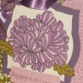 The flower and leaves are from the In Bloom stamp set, the script is from the Background Basics: Text Style stamp set, and the sentiment is from the CHA Exclusive Floral Fusion stamp set. I also...