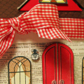 Leigh Ann Baird 

 I made this house for a hostess gift and filled it with candy.