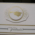 Embossed Vintage Ivory cardstock with Impressablities plate.  Embossed the swirl image from 2010 Anniversary set, as well as graduation cap with gold embossing powder.  Mounted all on brushed gold...
