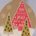 I used a die cut ornament and created a Christmas tree scene.  I wanted a rustic country feel with the traditional red and green Christmas colors.