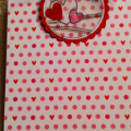 A small clipboard...with decorative clip with lots of ribbons!  A fun way to have a note pad close at hand.  Fun gift.