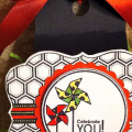 Black box, 2,4,6,8 variety.  Colorful ribbon and tag.  Coordinated shredded paper interior stuffing.