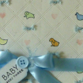 Sweet baby card designed like a crib blanket.