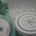 Embossed snowflake tag accents
