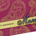 Supplies

Stamps: What the Doodle: Paisley, Family Ties

Ink: Versamark, Smokey Shadow

Paper: Scarlet Jewel, Prairie Grass, Smokey Shadow

Dies: Family Ties

Other: gold embossing powder
