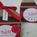 Stamps:  Teacher's Apple
Paper:  Kraft, Pure Poppy, White, Bitty Dots DP (PTI)
Ink:  Memento Tuxedo Black, Pure Poppy, Versamark
Accessories & Tools:  Pure Poppy Twill Ribbon, Oval Nesties, Tag...